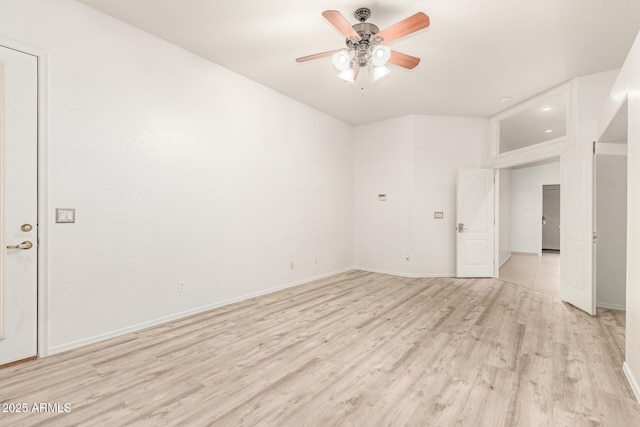 unfurnished room featuring light wood-style floors, baseboards, and a ceiling fan