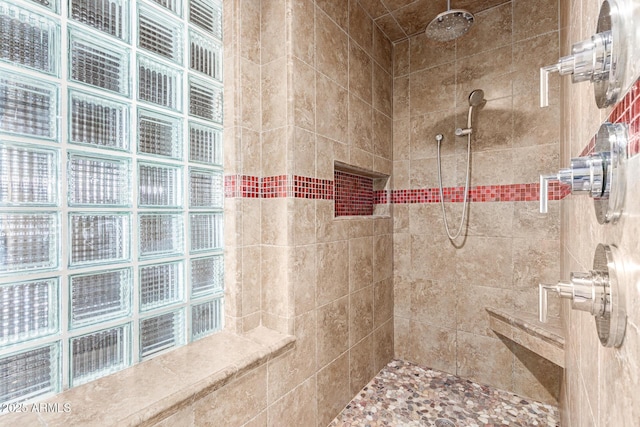 bathroom with a tile shower