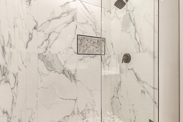 full bath featuring a marble finish shower