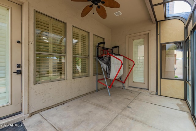 view of patio / terrace with ceiling fan and visible vents