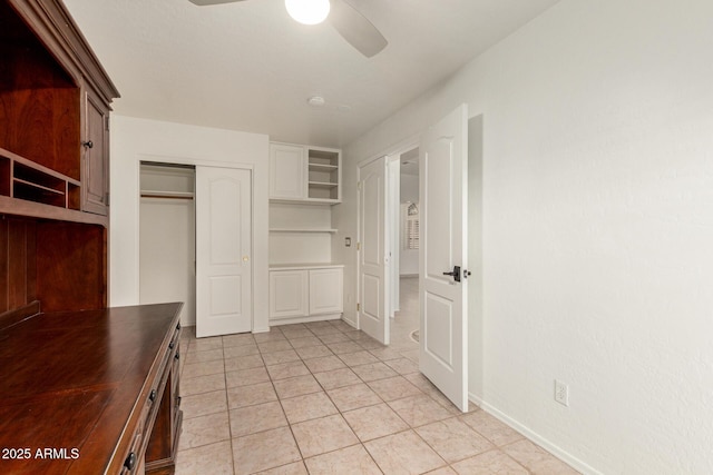 interior space featuring ceiling fan and light tile patterned floors