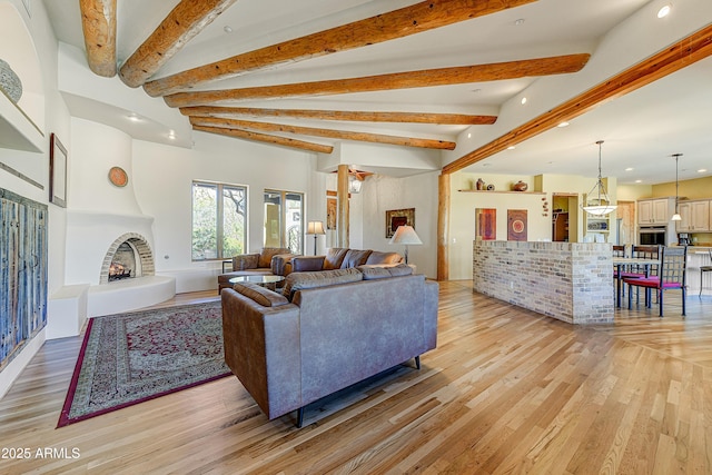 9415 N 124th St, Scottsdale, AZ 85259 - living area with light wood-style flooring, recessed lighting, beam ceiling, and a large fireplace