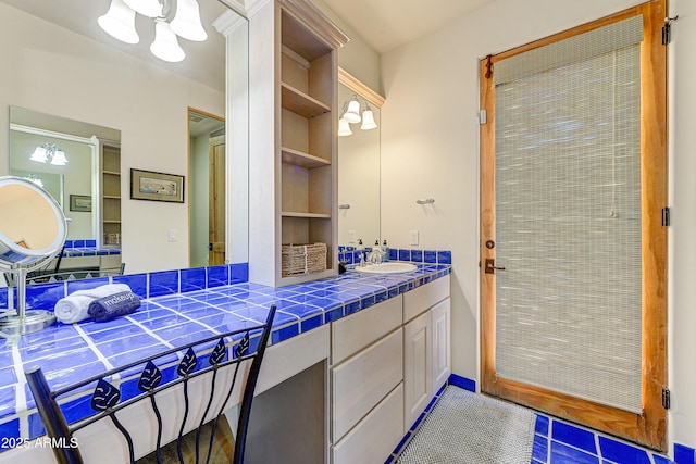 9415 N 124th St, Scottsdale, AZ 85259 - bathroom featuring vanity, tile patterned flooring, and built in shelves