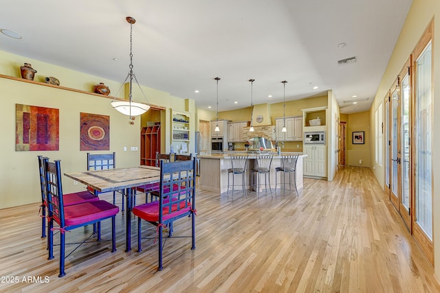 9415 N 124th St, Scottsdale, AZ 85259 - dining room featuring light wood-type flooring and recessed lighting