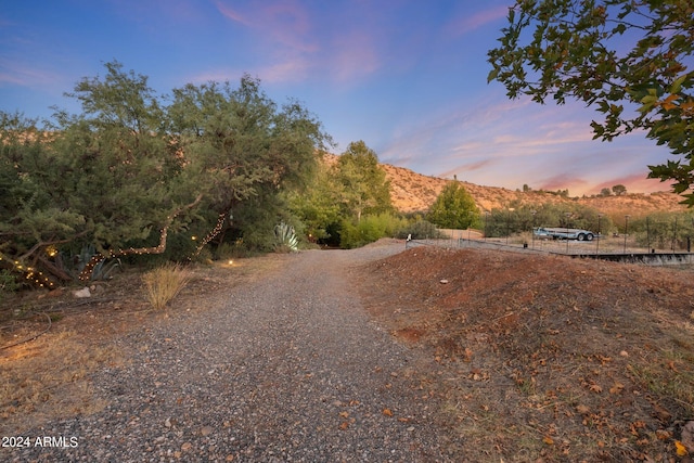 view of street featuring a mountain view and a rural view