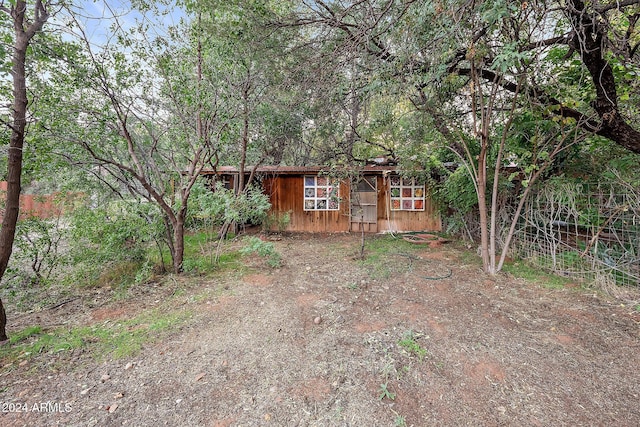 view of front of home featuring an outbuilding