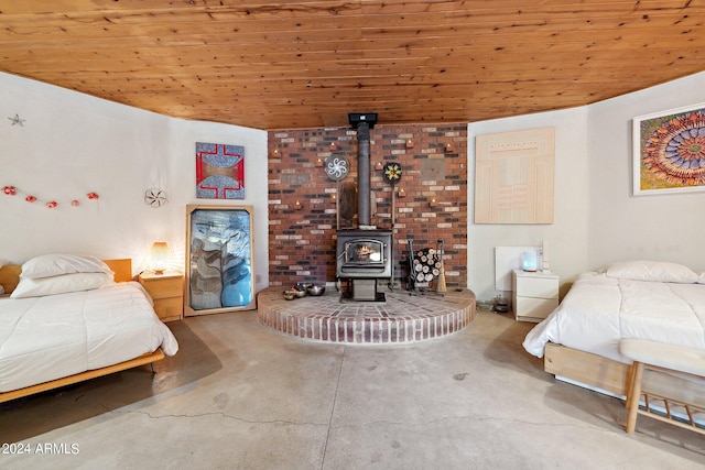 bedroom featuring wood ceiling and a wood stove