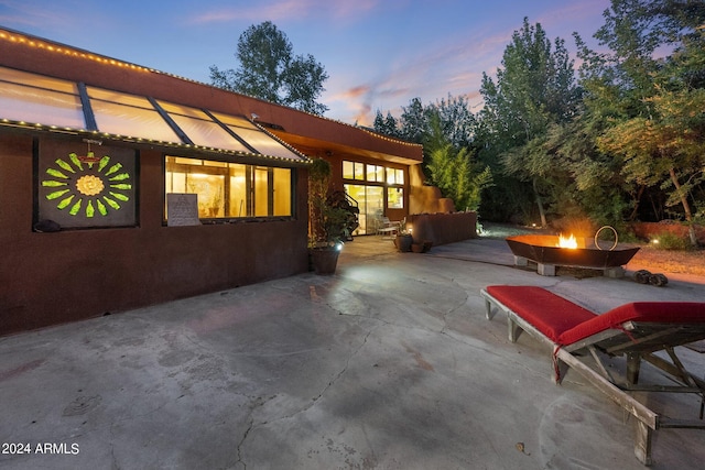 view of patio terrace at dusk