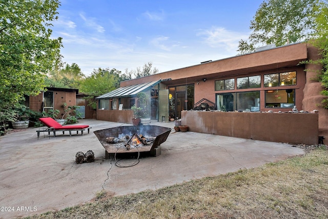 rear view of property featuring a patio