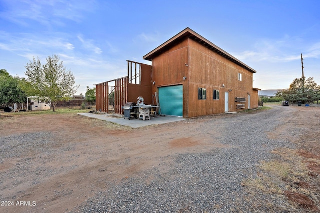 view of side of property featuring a garage