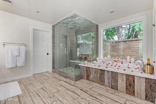 bathroom featuring visible vents, baseboards, wood finish floors, recessed lighting, and a stall shower