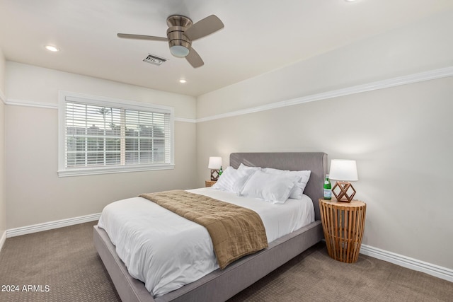 carpeted bedroom featuring recessed lighting, baseboards, and visible vents