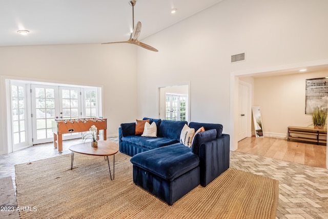 living room with a ceiling fan, baseboards, visible vents, high vaulted ceiling, and recessed lighting