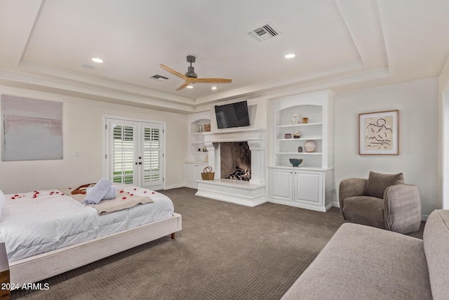 bedroom with visible vents and a raised ceiling