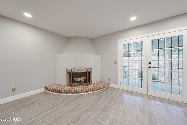 6533 N 7th Ave Unit 18, Phoenix, AZ 85013 - unfurnished living room with baseboards, plenty of natural light, light wood finished floors, and recessed lighting
