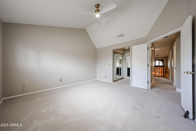 6533 N 7th Ave Unit 18, Phoenix, AZ 85013 - unfurnished bedroom with light colored carpet, baseboards, lofted ceiling, and ceiling fan