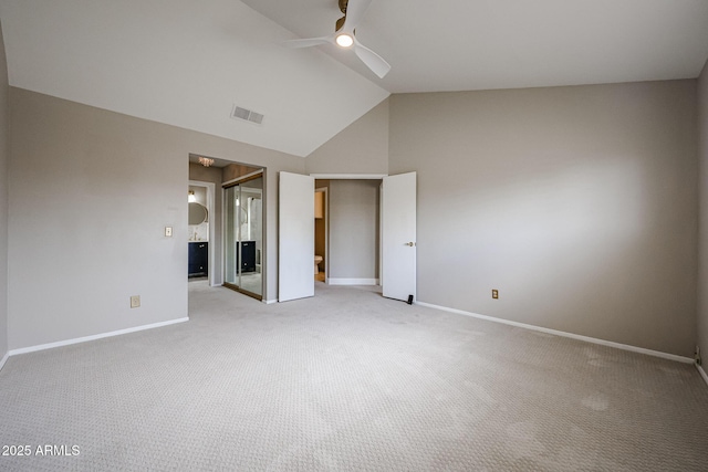 6533 N 7th Ave Unit 18, Phoenix, AZ 85013 - unfurnished bedroom with light colored carpet, baseboards, high vaulted ceiling, and a closet