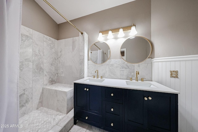 6533 N 7th Ave Unit 18, Phoenix, AZ 85013 - full bath featuring tiled shower, double vanity, wainscoting, and vaulted ceiling