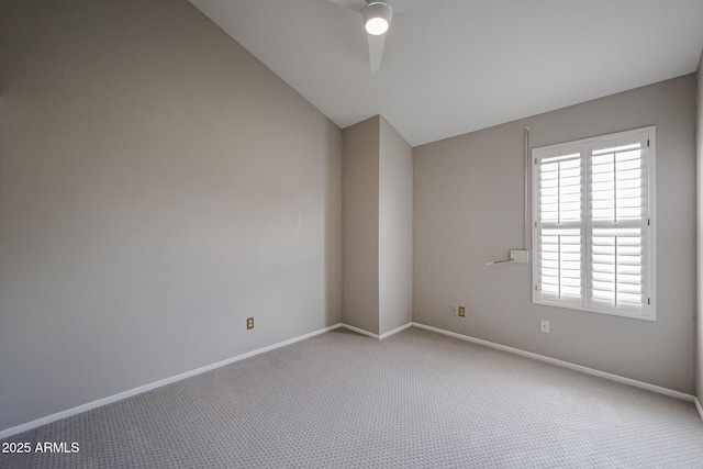 6533 N 7th Ave Unit 18, Phoenix, AZ 85013 - carpeted spare room featuring lofted ceiling, baseboards, and ceiling fan