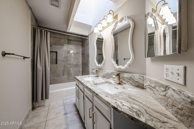 6533 N 7th Ave Unit 18, Phoenix, AZ 85013 - bathroom with double vanity, shower / tub combo with curtain, tile patterned floors, and baseboards