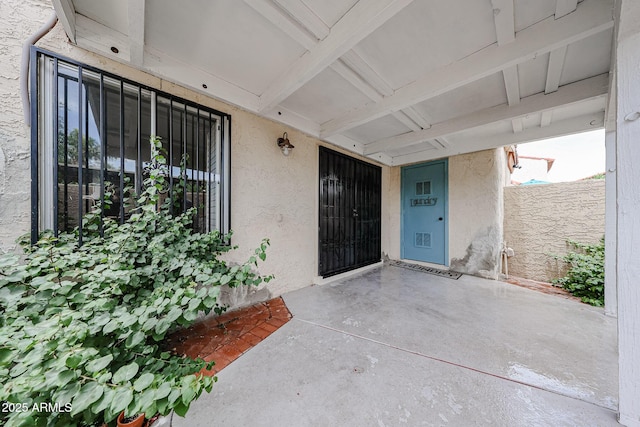 6533 N 7th Ave Unit 18, Phoenix, AZ 85013 - doorway to property with a patio area and stucco siding