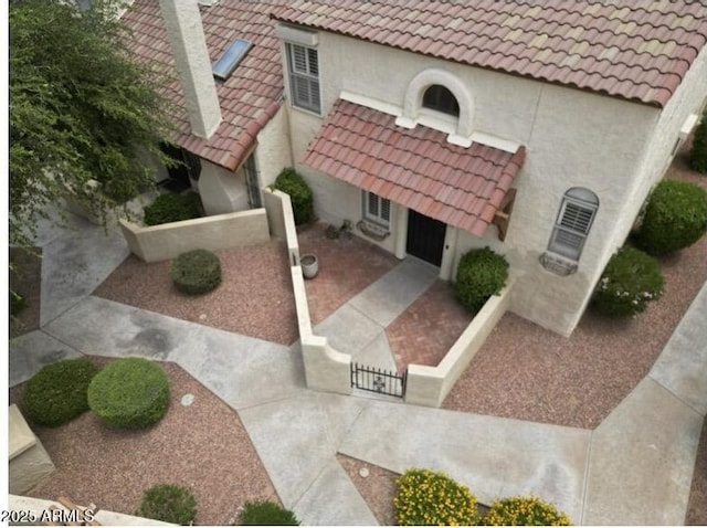 6533 N 7th Ave Unit 18, Phoenix, AZ 85013 - view of front of property with stucco siding and a tile roof