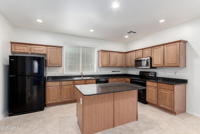 kitchen with black appliances, a sink, a center island, recessed lighting, and dark stone counters