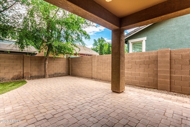 view of patio / terrace featuring fence