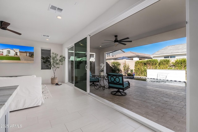 view of patio featuring ceiling fan