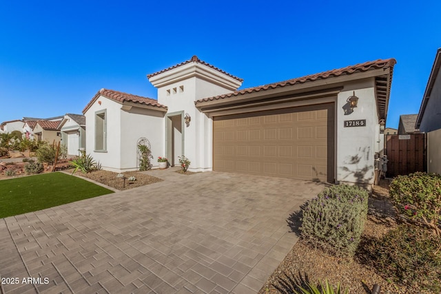 mediterranean / spanish-style home featuring a garage