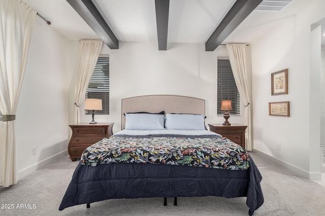 bedroom with beamed ceiling and light carpet