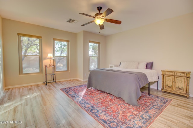 bedroom featuring ceiling fan and light hardwood / wood-style floors