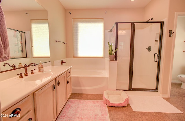 full bathroom with tile patterned flooring, vanity, toilet, and shower with separate bathtub