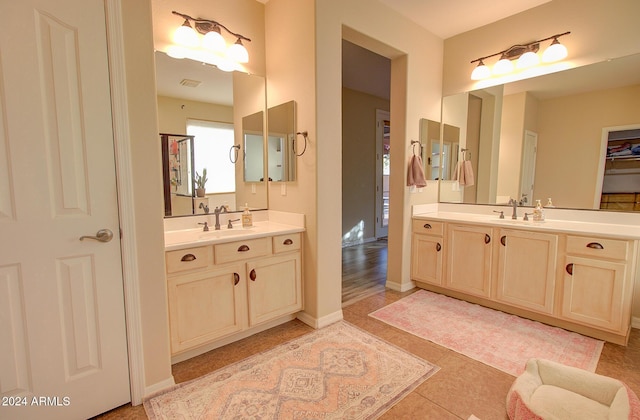 bathroom with tile patterned flooring and vanity