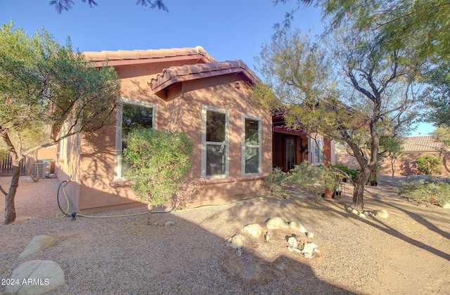 view of front of property with cooling unit