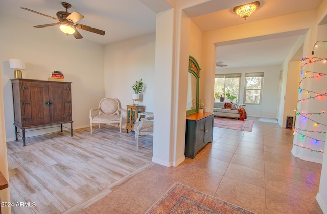 interior space with ceiling fan and light hardwood / wood-style floors