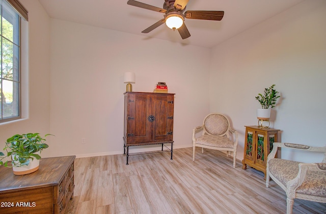 sitting room featuring ceiling fan and light hardwood / wood-style flooring