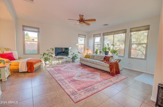 tiled living room featuring ceiling fan