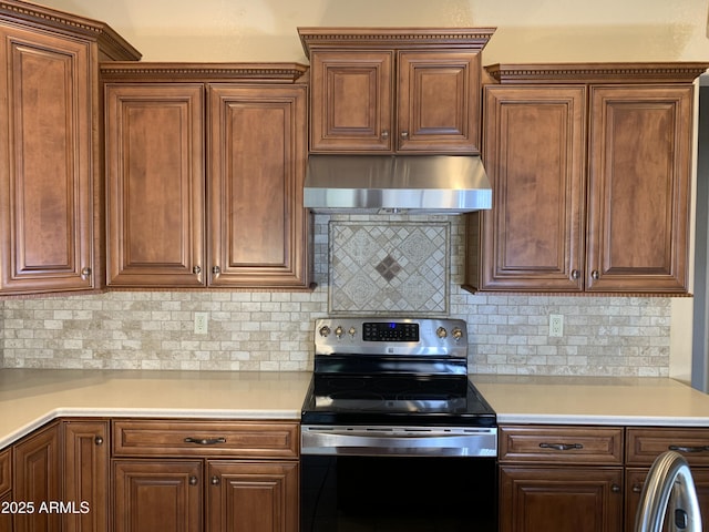 kitchen with backsplash, stainless steel range with electric cooktop, and exhaust hood