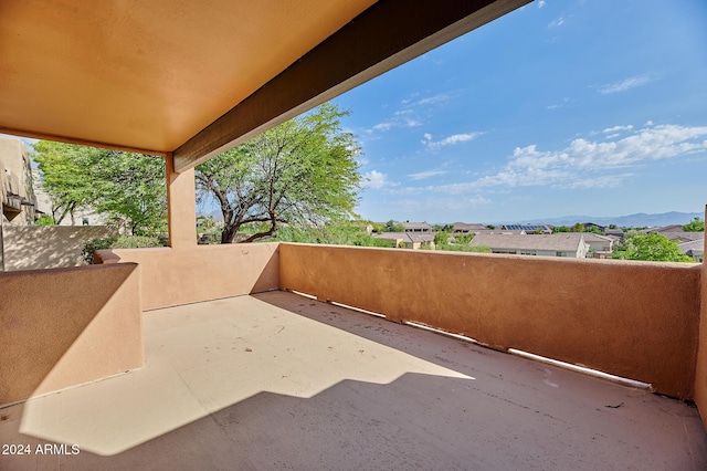 view of patio / terrace featuring a mountain view and a balcony