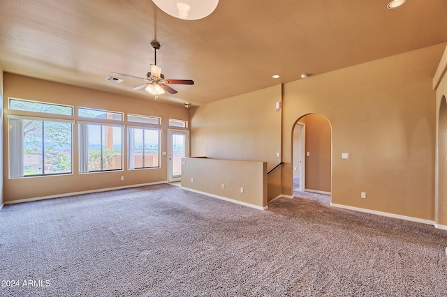 spare room featuring ceiling fan and carpet floors