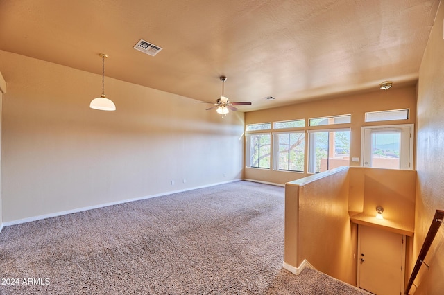 spare room featuring carpet flooring and ceiling fan