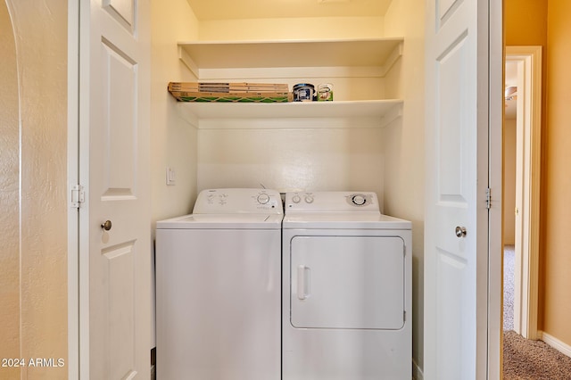 laundry area with washing machine and dryer