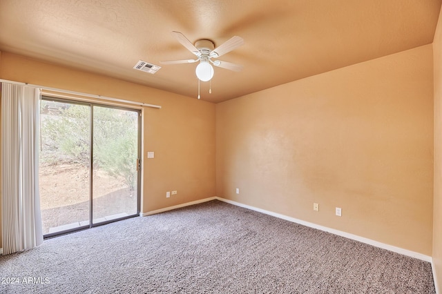 unfurnished room featuring carpet, ceiling fan, and a textured ceiling