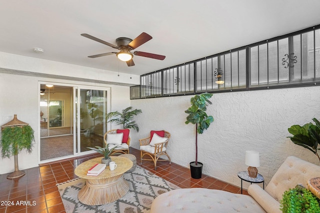 interior space with a wealth of natural light and ceiling fan