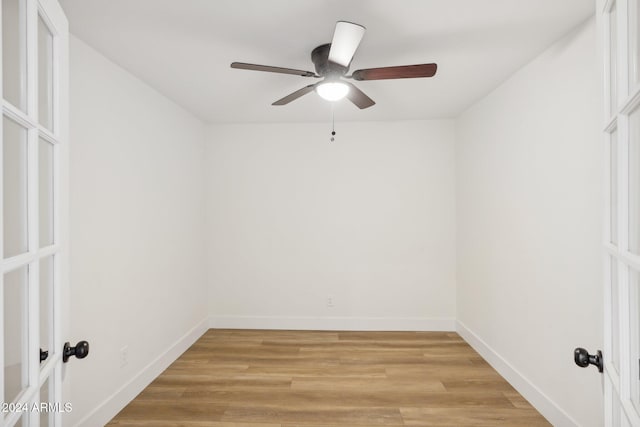 unfurnished room with ceiling fan and light hardwood / wood-style flooring