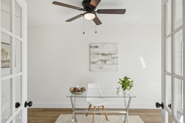 office space with french doors, ceiling fan, and light hardwood / wood-style flooring