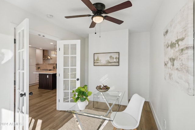 office featuring ceiling fan, wood-type flooring, and french doors