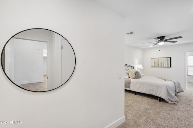 bedroom with light colored carpet and ceiling fan