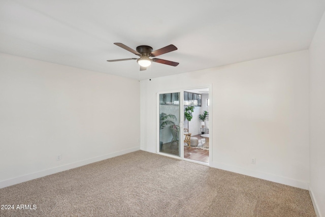 unfurnished room featuring ceiling fan and carpet floors